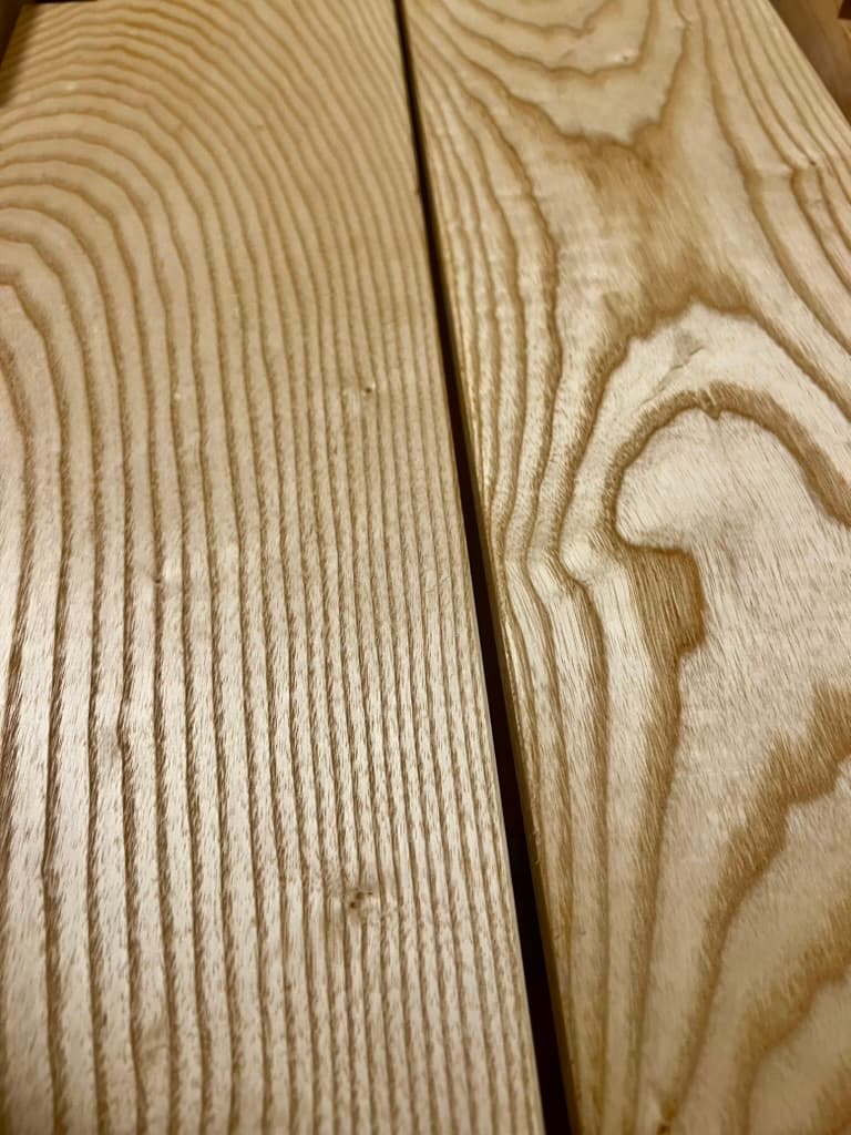 Close-up of wood grain on freshly milled boards
